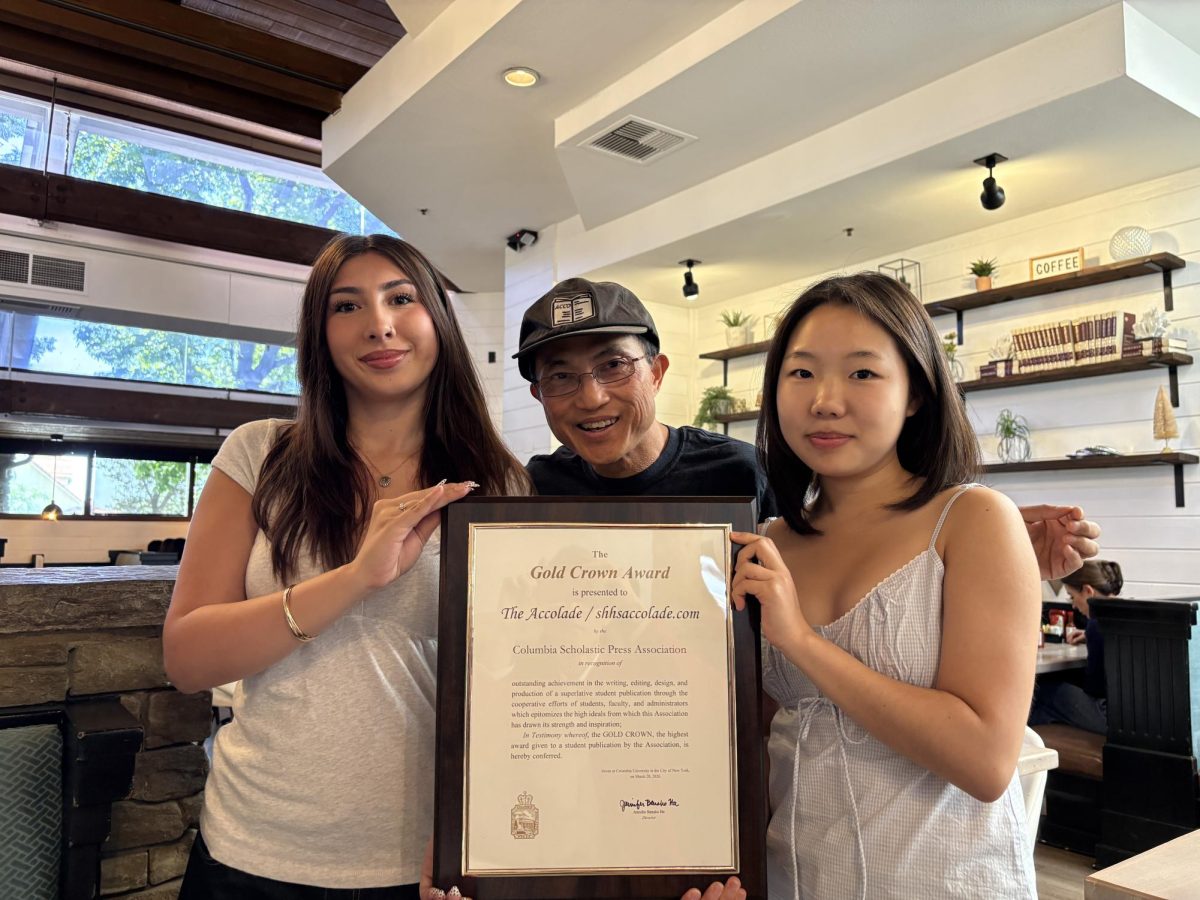 Berumen (left) holds up the Columbia Scholastic Press Association Gold Crown Award with Tommy Li and Han at Toast Brea after the trio ate brunch together on Wednesday, March 25.