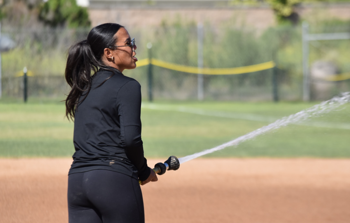 New head softball coach Alia Marquez directs her team on Wednesday, April 15, on the SH field. 