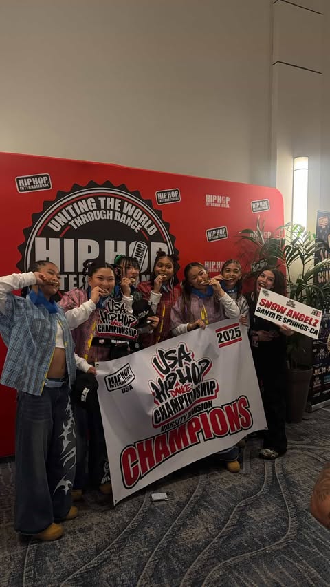 Senior Ella Lee shows off her gold medal with her Angelz teammates at the 2025 USA Hip Hop Dance Championship on Saturday, Aug. 2 after they placed first in the varsity division.