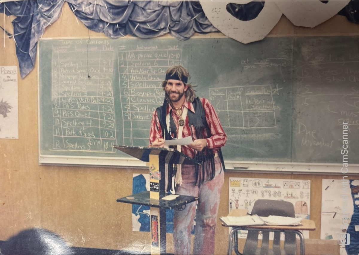 English teacher Randy Oudega lectures his students while dressed up as a ‘hippie’ for Halloween at Sunny Hills in 1990.