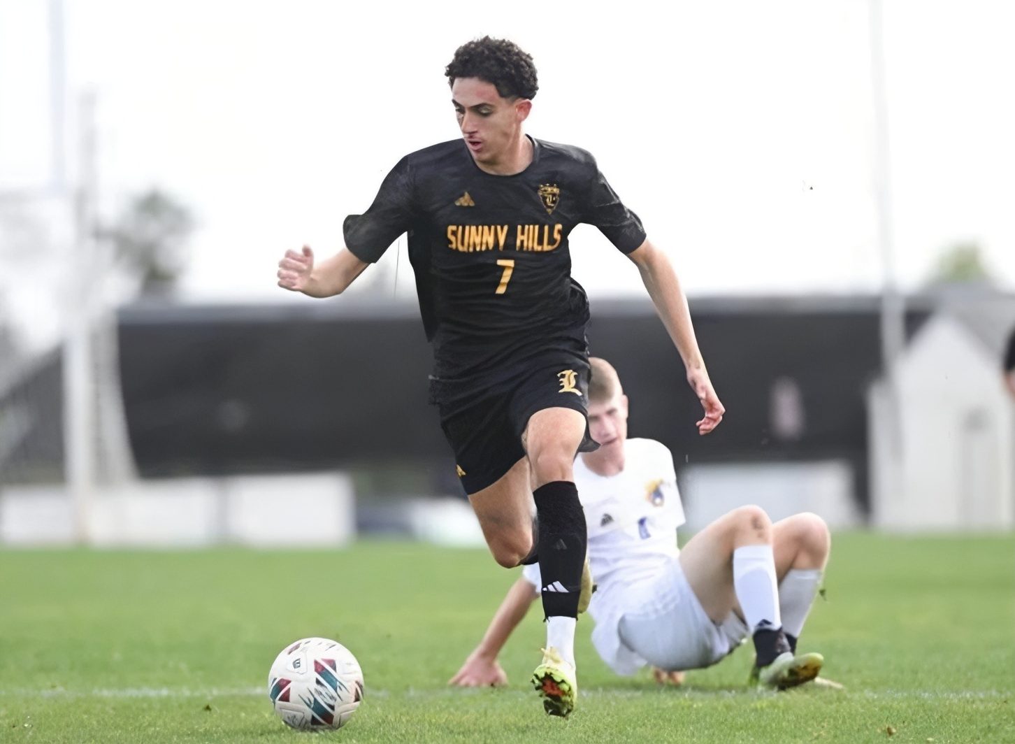 Striker senior Mina Besada dribbles the soccer ball during a game against Fountain Valley High School on Wednesday, Feb. 11 at the track field. 